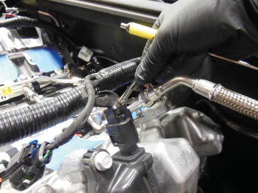 Remove the fuel safety clips from the fuel line as shown.