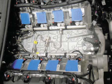 105. Remove the blue tape from the intake ports. Spray a clean rag with Tri-fl ow or equivalent lubricant.