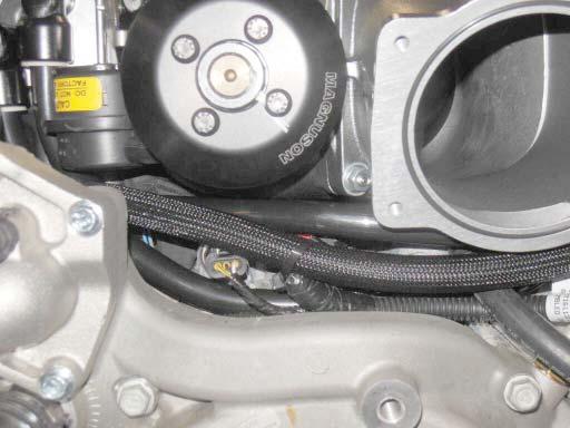 Install cable tie around 13.5 hose and wiring harness where shown.