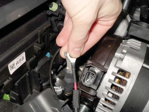 Overlap the short wire from the pump harness fuse holder over the alternator ring terminal.
