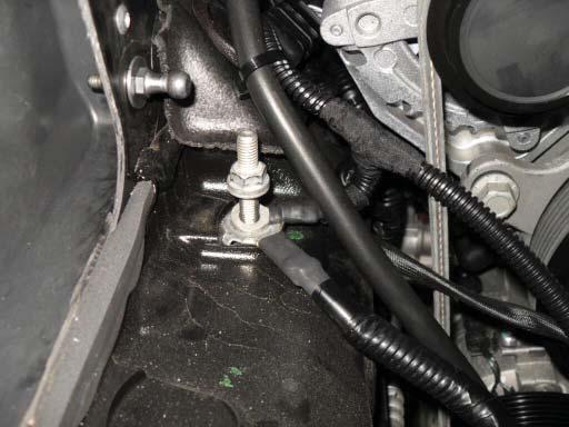 165. Remove the stud/bolt securing a factory ground point in front and right of the alternator.