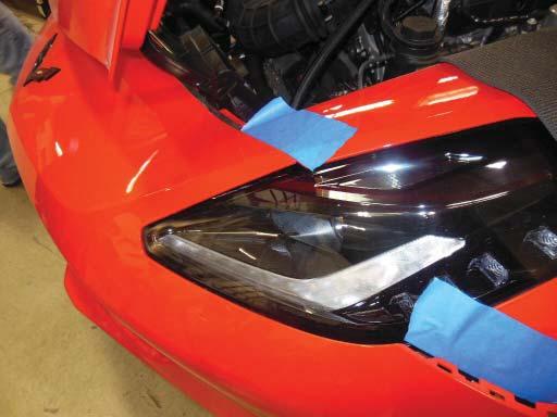 The retainer bracket near the headlight is shown that may have been loosened in steps #208-209.