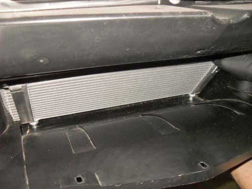 Install the lower LTR through front opening in the radiator duct.