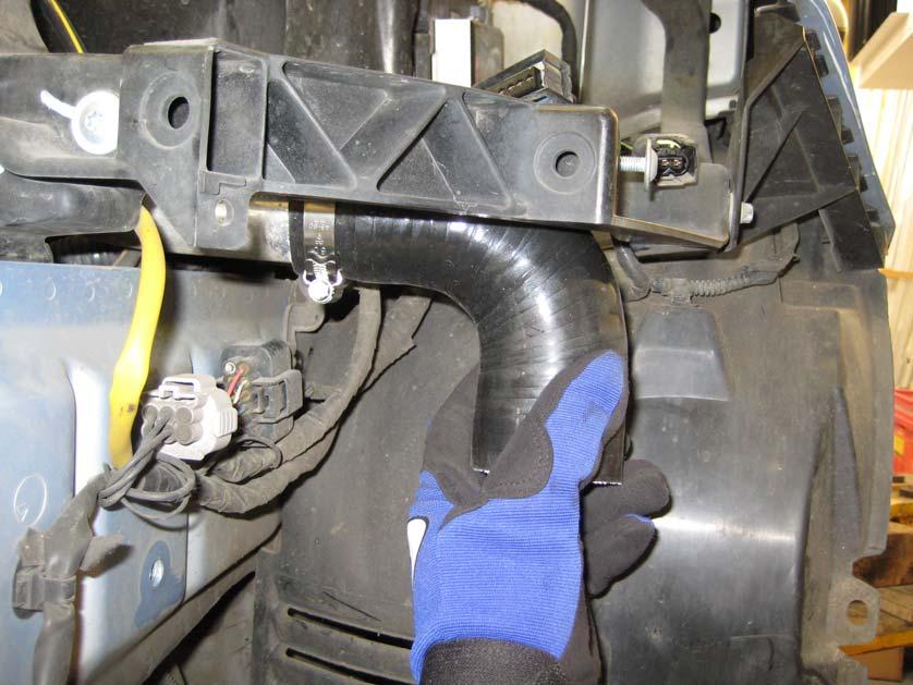 22. On the other side of the car, place the remaining 90 degree silicon hose on the