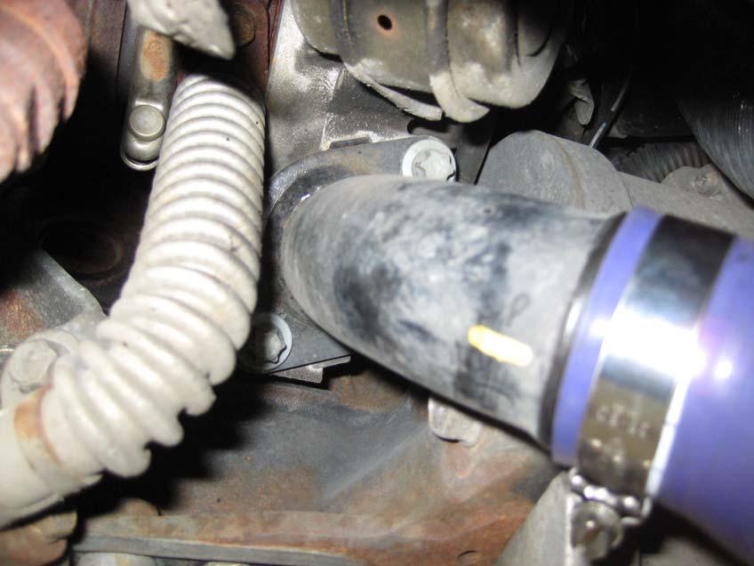 9. Working back under the front of the car, locate the turbo outlet pipe, and using a 10mm