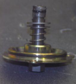 Apply anti corrosion compound to retention disc bolt holds and re-fit.