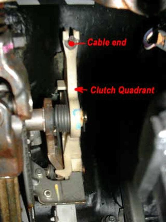 10. Working under the hood, remove the clutch cable from the