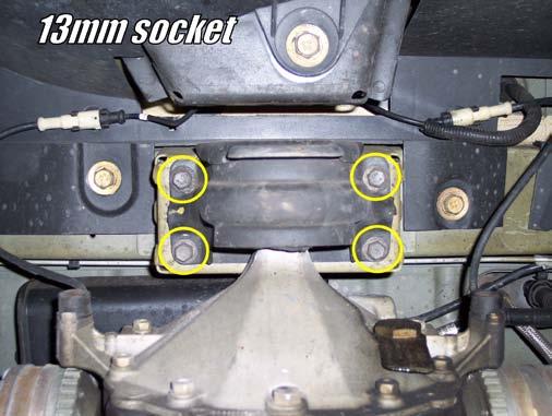 4) Slowly lower the transmission jack and