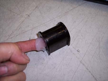 10) Open the bushing and push it over the bar.