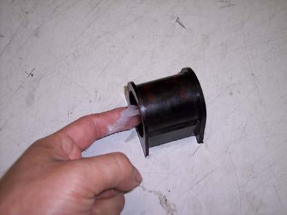 14) Open the bushing and push it over the bar.