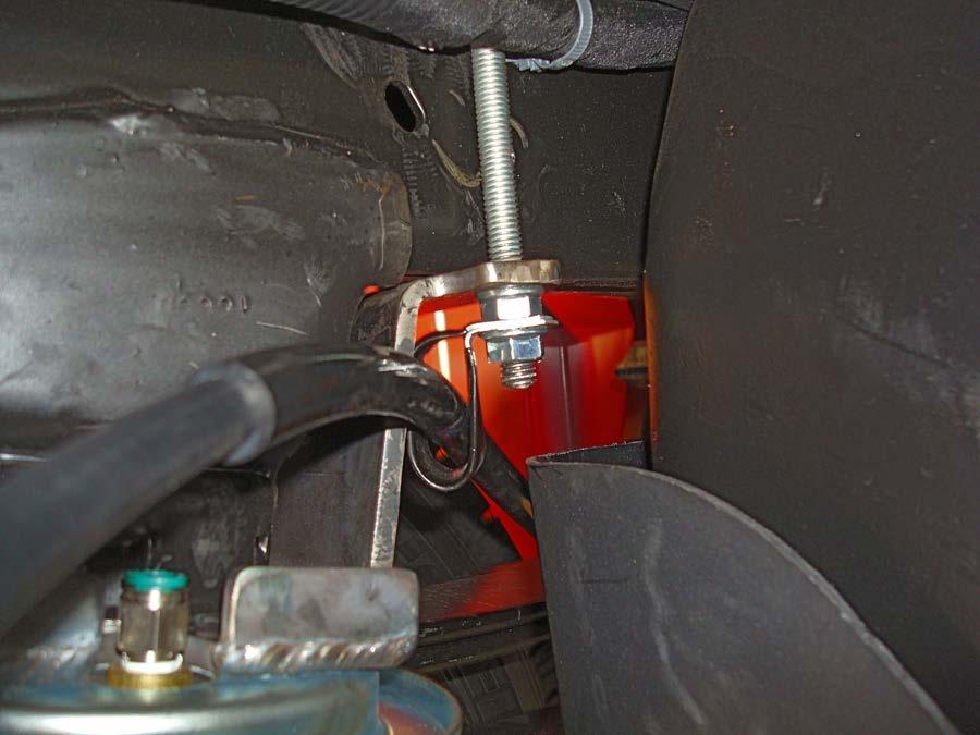 Attach the emergency brake cable removed in the getting started section with the emergency brake cable bracket (Q) and 3/8 serrated flange lock nut (P) (fig. 10).