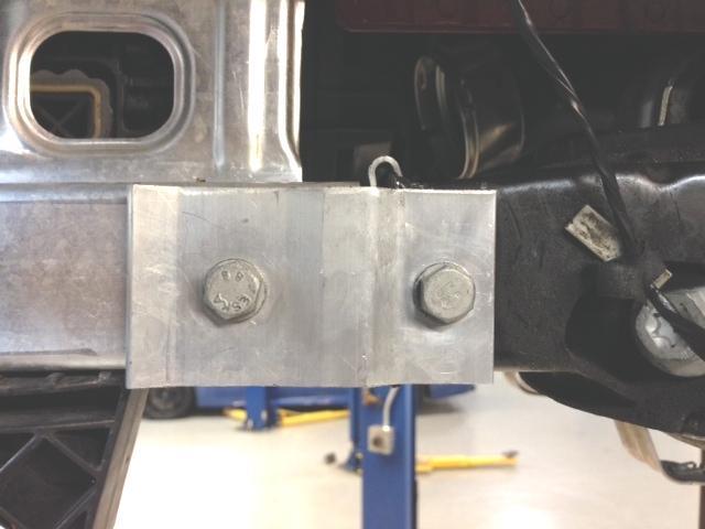 Remove the two bolts on both sides of the subframe going to the front