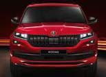 Exterior features include the gloss black front grille, chrome exhaust pipe and