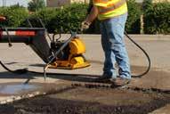 both blow debris out of the pothole and evenly spray the asphalt emulsion by simply moving