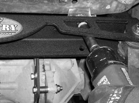 Secure the newly installed front differential relocation bracket to the front portion of the sub frame. Secure using the stock hardware. Do not tighten at this point. 49.