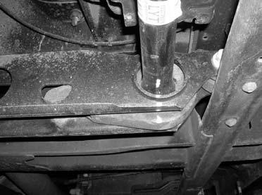 Tap the stock torsion bars forward until the stock torsion bar cross member can be removed.