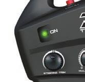 RADIO SYSTEM BASIC ADJUSTMENTS Throttle Neutral Adjustment The throttle neutral adjustment is located on the transmitter face and controls the forward/reverse travel of the throttle trigger.