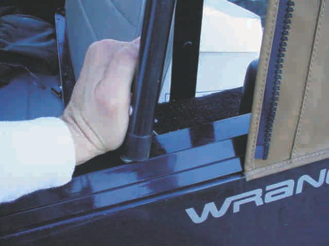 Push the Spreader Bars up until they snap into place. 7. Start horizontal and vertical zippers on the Quarter Window about 4-6 inches (Figure 7). 8.