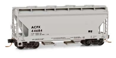 American Car & Foundry Road Number ACFX 44684 This two-bay Centerflow covered hopper with round hatches is painted light gray with black reporting marks and dim data.