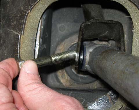 side and gradually unscrew the bolt with a 12mm wrench.