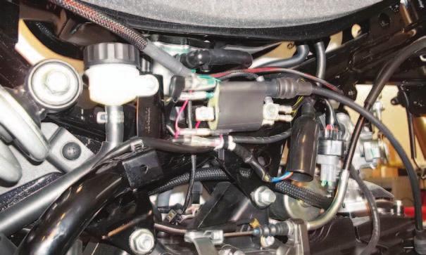 FIG.D 8 Plug the pair of RED/WHITE wires with spade connectors on the PCV wiring harness in-line of the stock RED wire and the black Ignition Coil tab.
