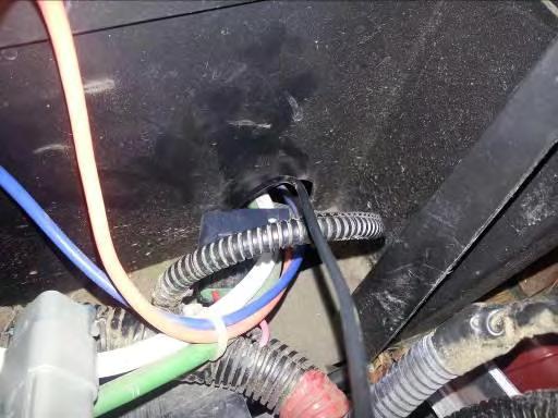 C. Installing the Speed Sensor Ground: 1. Run the 36 black wire from the conversion harness out through the back of the control compartment to the motor. (Figure 11) 2.