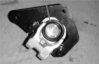opening and place a shop towel under the caliper to avoid contamination caused by the removed