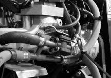 4. Move the lever on the engine cover backward into the OFF position to stop airflow through the wand. 08145 5. Put the blower attachment on the back of the machine.