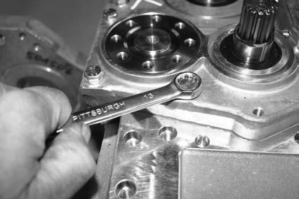 Using bearing removal tool Part # 501165 remove first bearing (B).