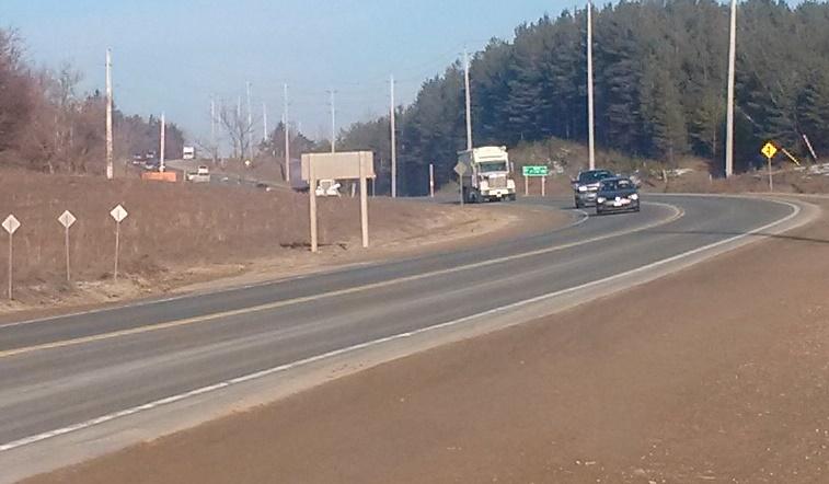 date of photo: February 22, 2017 photo taken from edge of shoulder on Hwy 89 vehicles approaching 3 rd Line from GREATER than 320 metres away truck is