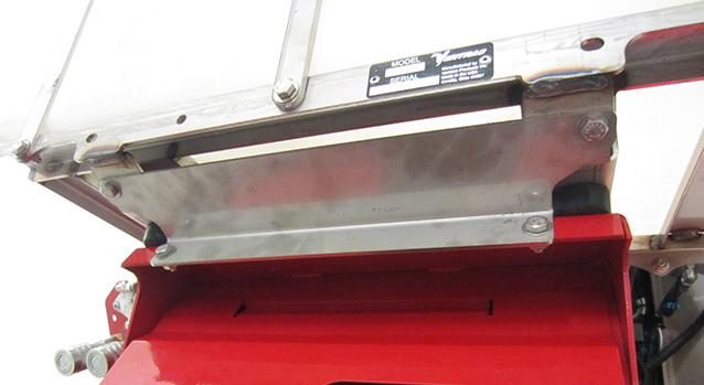 . Install the front accessory mount bracket (K) onto the brine tank frame and the front flange