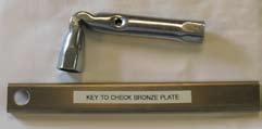 Use the Key wrench shown in Fig 4 to lift the bronze plate manually. Wrench attaches to the small plate denoted by the X in Figure 2. Set Lubricator to 4 months before use.