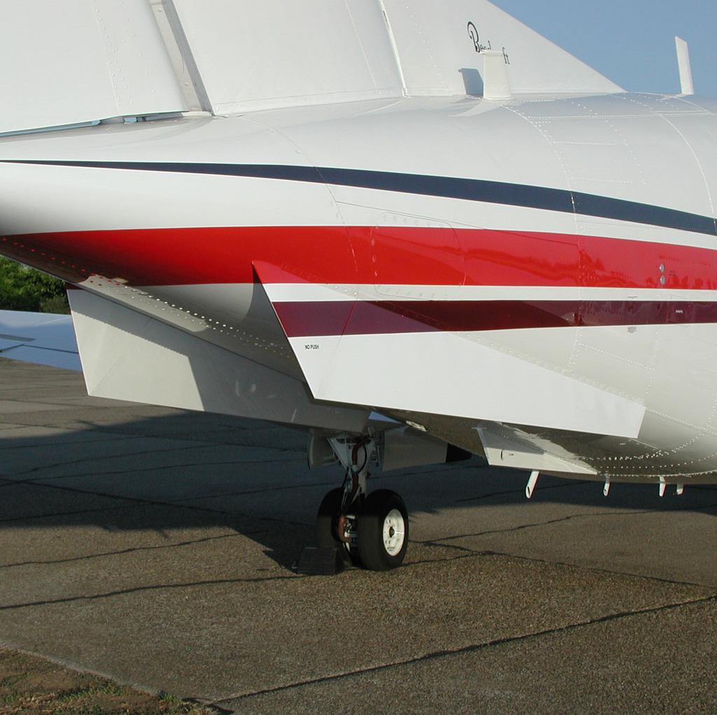 the lower aft section of the tail. The modification improves directional stability and pilot control, improves passenger ride quality, reduces drag and increases yaw- damper inoperative altitudes.