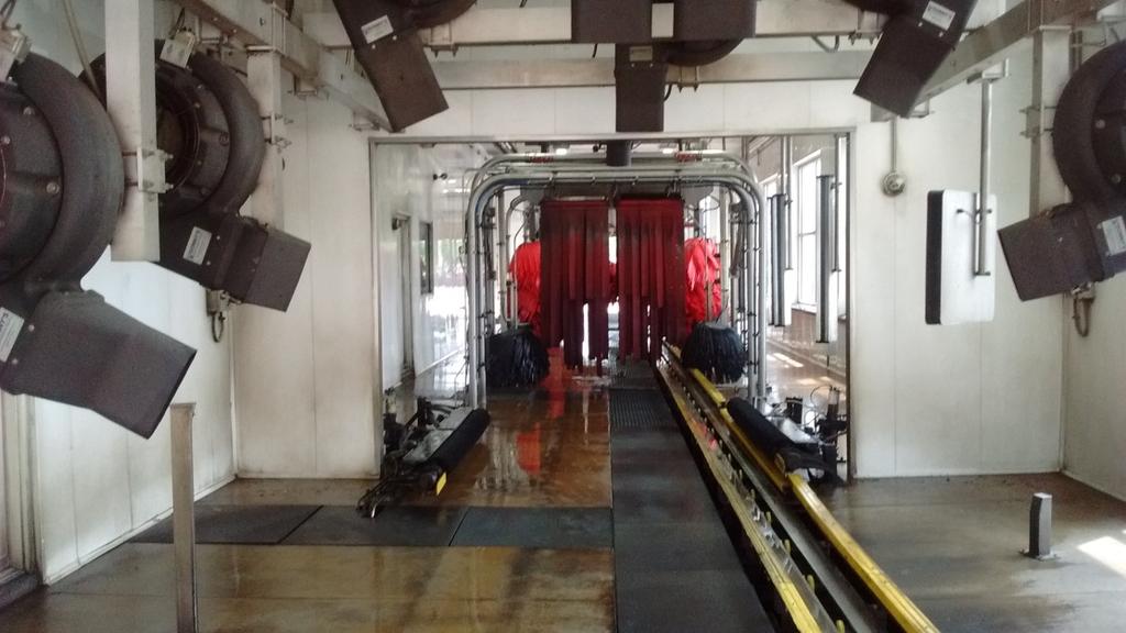 Figure 2 shows a view of the car wash tunnel from the exit door. There are ten (10) centrifugal blowers attached to steel poles.