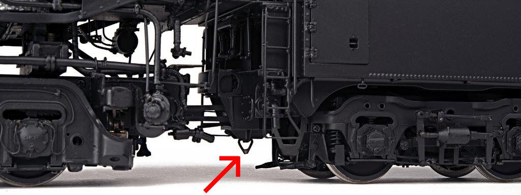 and tender, the drawbar on the locomotive should be lined up (slightly raise) with the drawbar 'pocket' on the tender and the two units simply pushed together, the drawbar will automatically lock in