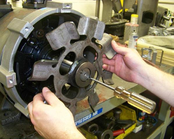 Remove the fan and key from the rotor drive end by first loosening the fan hub screw.
