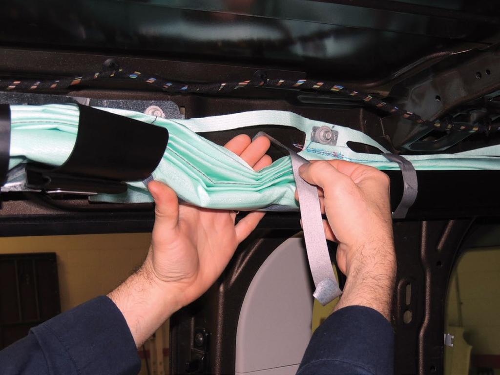 5. For each of the side curtain airbag tape pieces removed from the factory locations, cut a 10 in (25.4cm) piece of side curtain airbag tape from the roll.