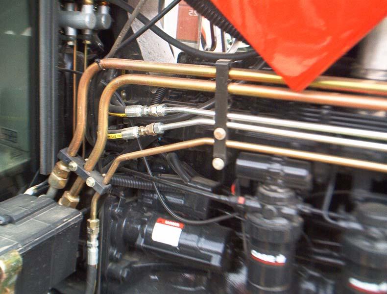 5.3 Connect the Hydraulic Hoses Detach existing steer hoses.