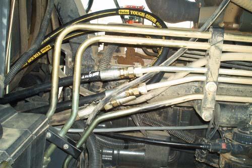 Connect the right Steer In hose to the bottom hose on the tractor steering unit. Connect the left Steer In hose to the top hose on the tractor steering unit.