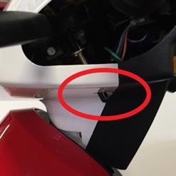 Engaging Parking Brake Underneath throttle there will be a small bar with a black nub covering it. This is to engage the parking brake.