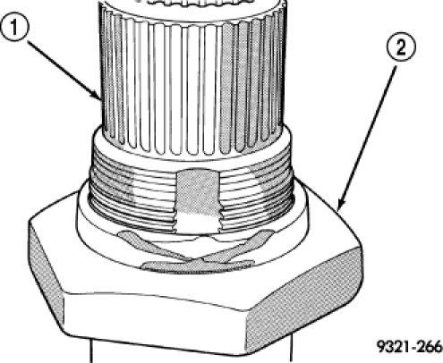 46. Using a die grinder or equivalent, grind the stakes in the shoulder of the shaft nut (2) as shown. Do not grind all the way through the nut and into the shaft.