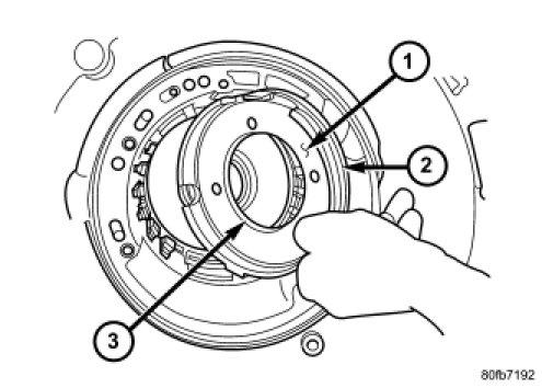 NOTE: The Low/Reverse Clutch Piston has bonded seals which are not individually serviceable. Seal replacement requires replacement of the piston assembly. 59.