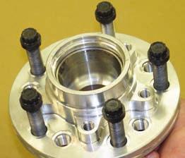 Remove any nicks or burrs on the spindle mount faces that may interfere with the installation of the new brake components. Clean and de-grease the spindles and saved components.