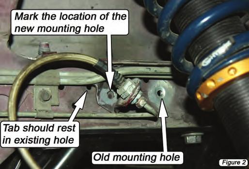 Remove the 8mm hex-head size mounting screw retaining the brake line bracket to the frame rail. (Figure 1) 5.