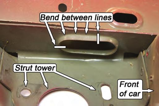 On the inboard face of the driver side upper frame rail, there is an
