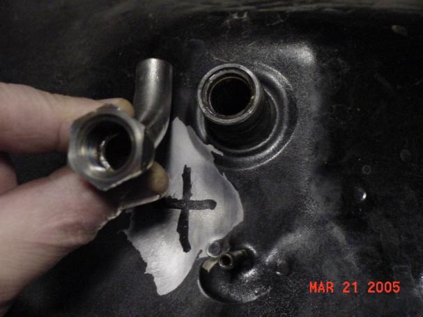 From center of petcock measure to rear of tank 1 ¼ and mark Drill ¾ hole at