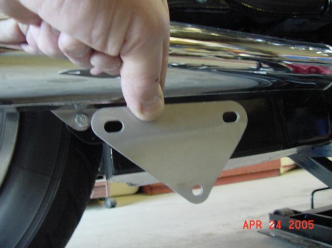 Remove kickstand switch and remove kickstand. Remove muffler-mounting nuts on both sides.