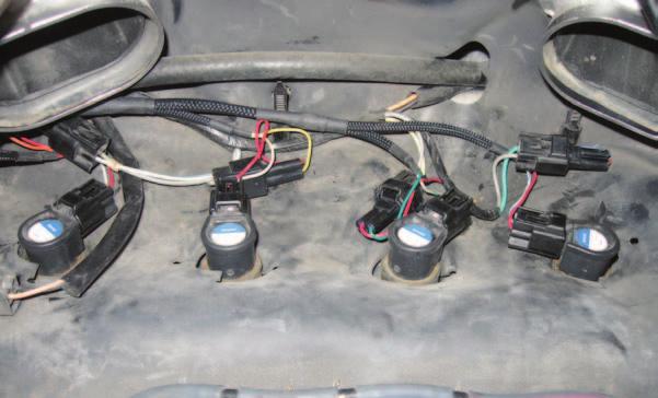 5 the stock wiring harness from each ignition coil stick (Fig. A). FIG.