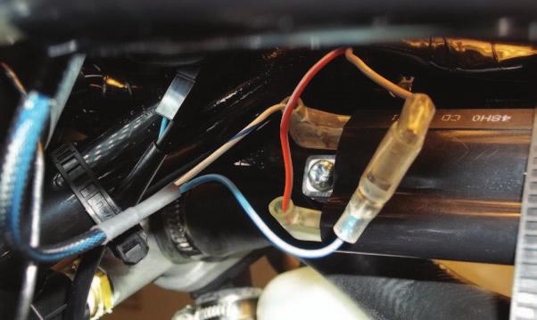 protected from shorting to chassis ground. FIG.P 22 Locate and unplug the stock connector for the bike s O2 sensor (Fig.