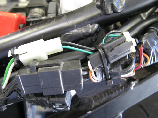 4. Locate the factory Crank Position Sensor (CKPS) connectors found on the outside of the subframe (on the left side near the starter relay).